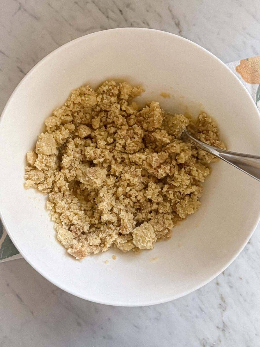 Ingredients for crust combined in a bowl.
