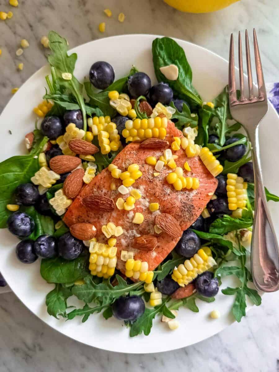Prepared Spinach and Arugula Salad in a bowl with a fork