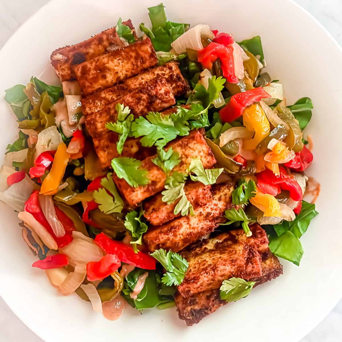 Prepared Tofu with Salad -- Fajita Edition in a bowl.