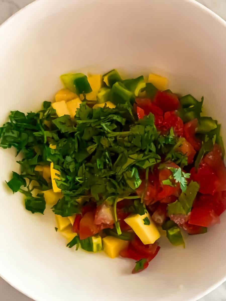 Fresh Mediterranean vegetable salad with tomatoes, cucumbers, herbs, and peppers - healthy and colorful.