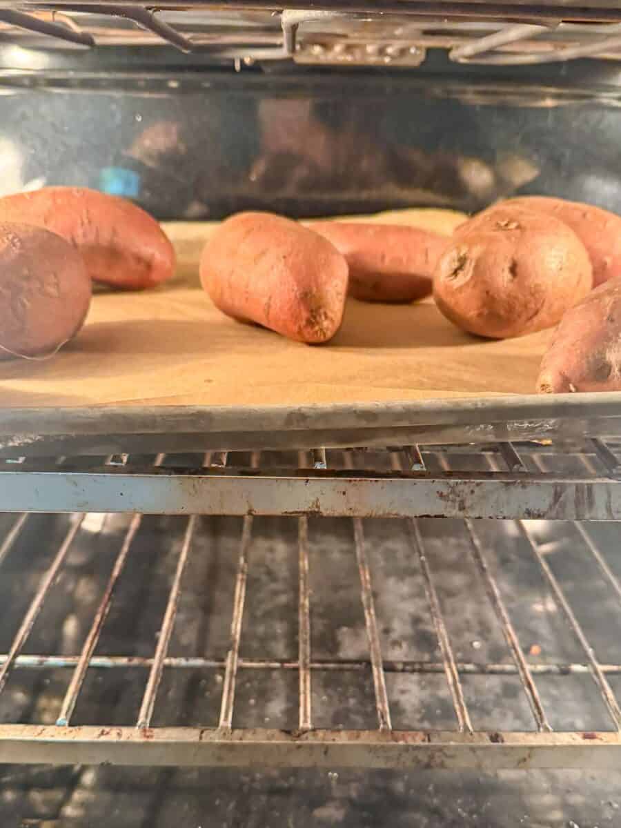 Sweet potatoes roasting in the oven for gluten free sweet potato casserole.