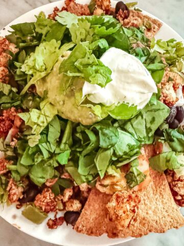 Tofu taco crumbles in baked nachos