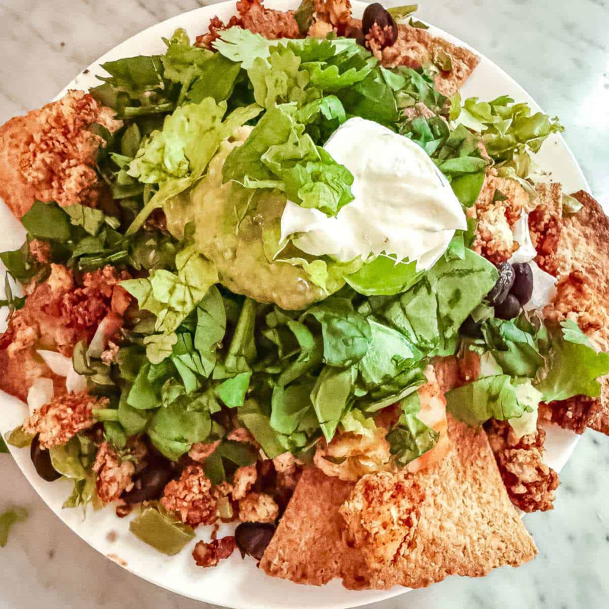 Tofu taco crumbles in baked nachos