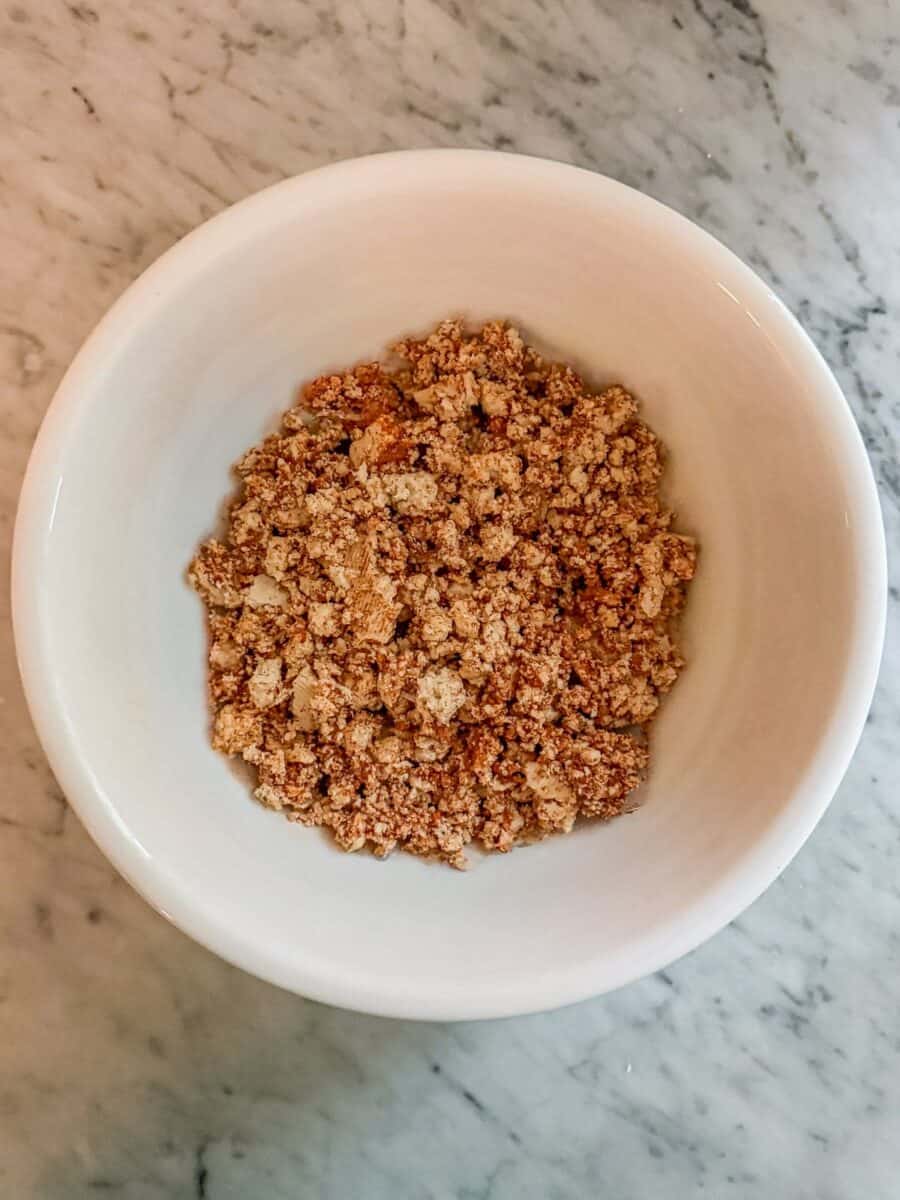 Tofu taco crumbles in a bowl prior to baking