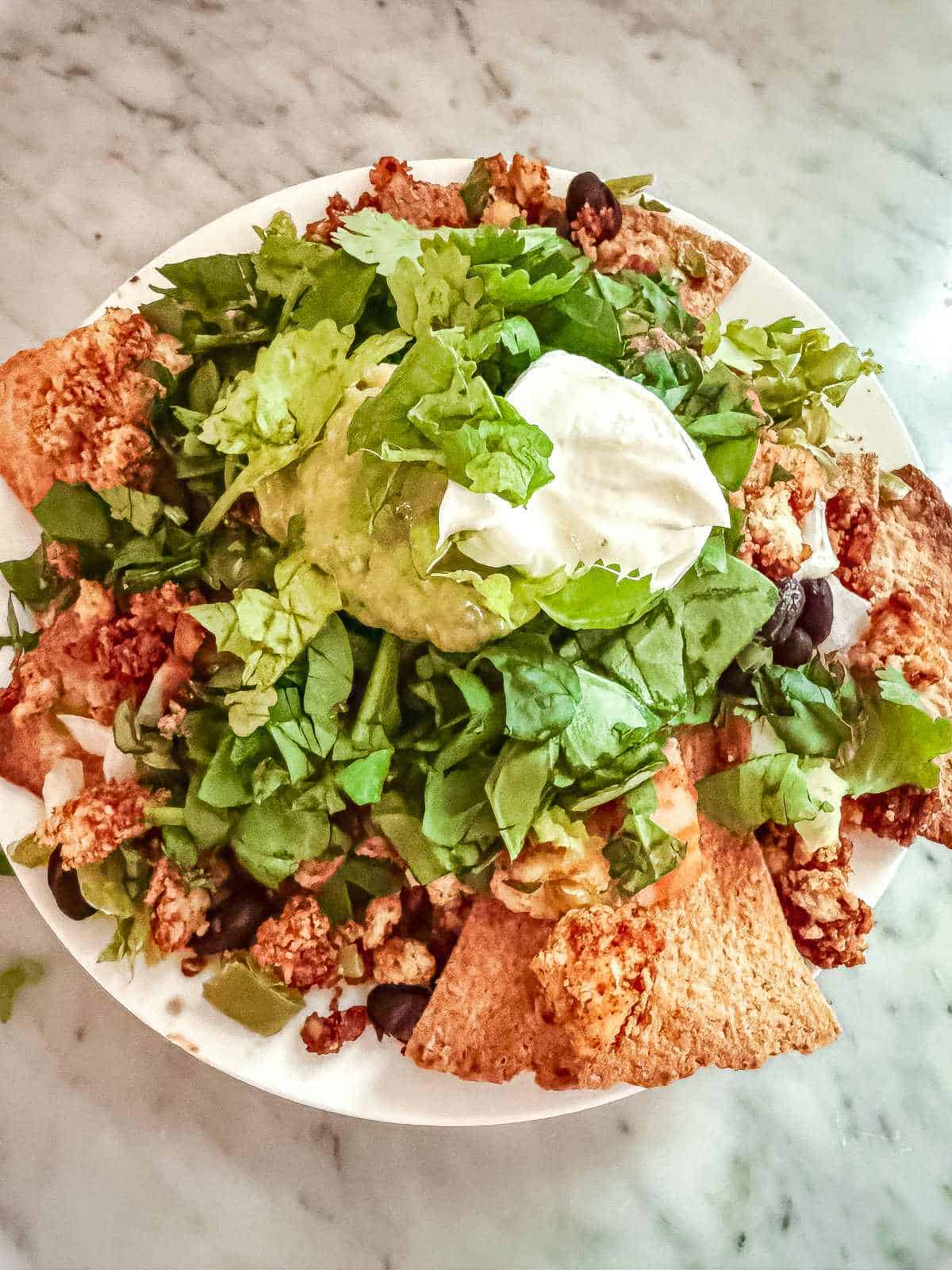 Tofu taco crumbles in baked nachos