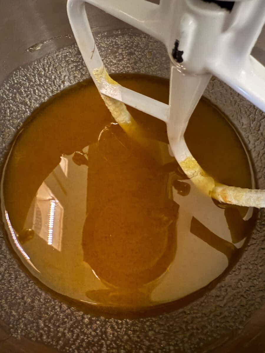Mix EVOO, eggs, sugars, and vanilla