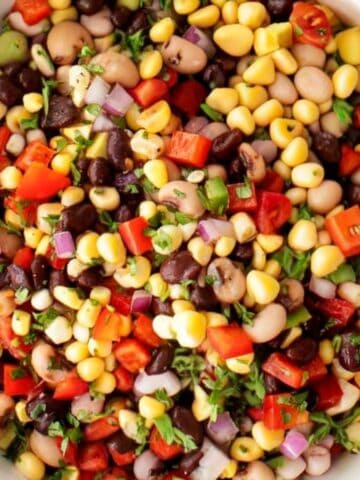 Beans, tomatoes, peppers, cilantro, corn mixed together.