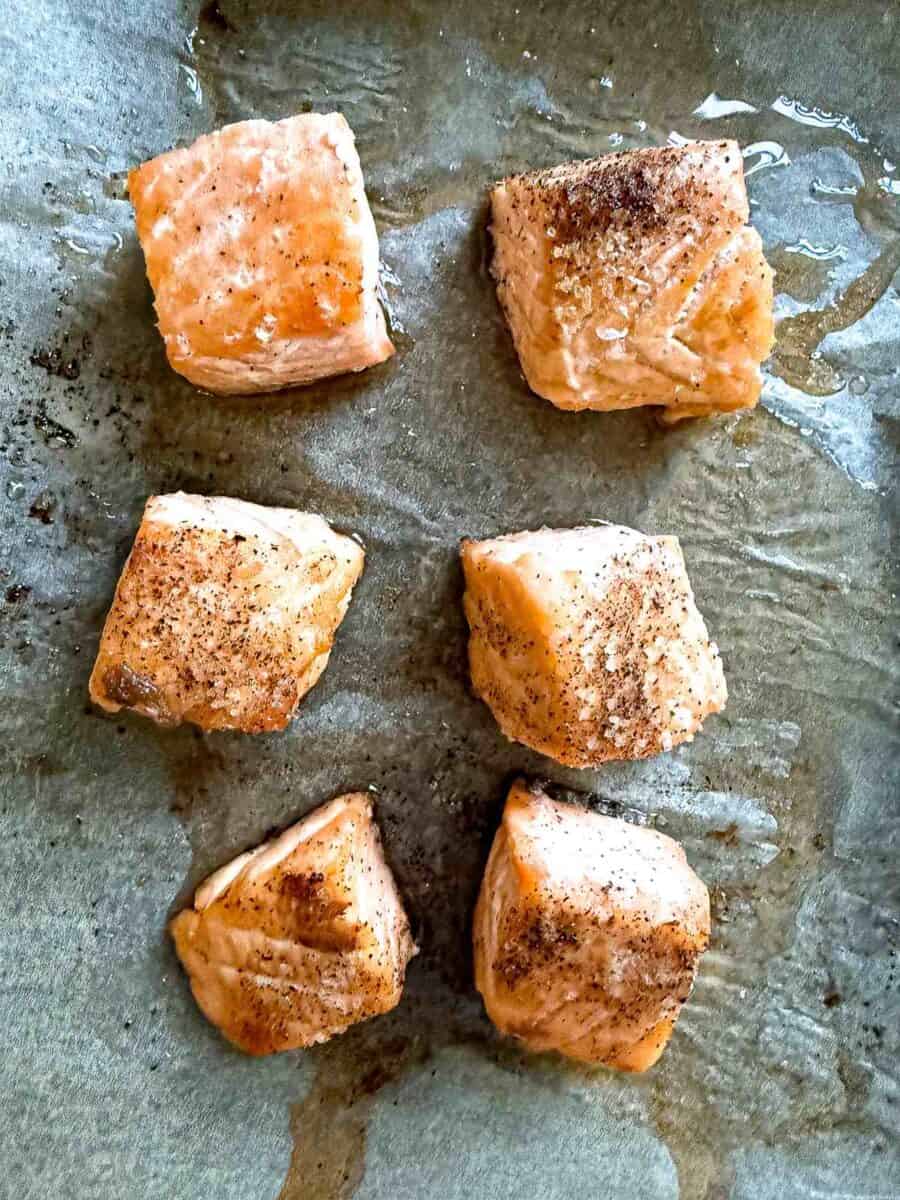 Crispy salmon bites on parchment paper
